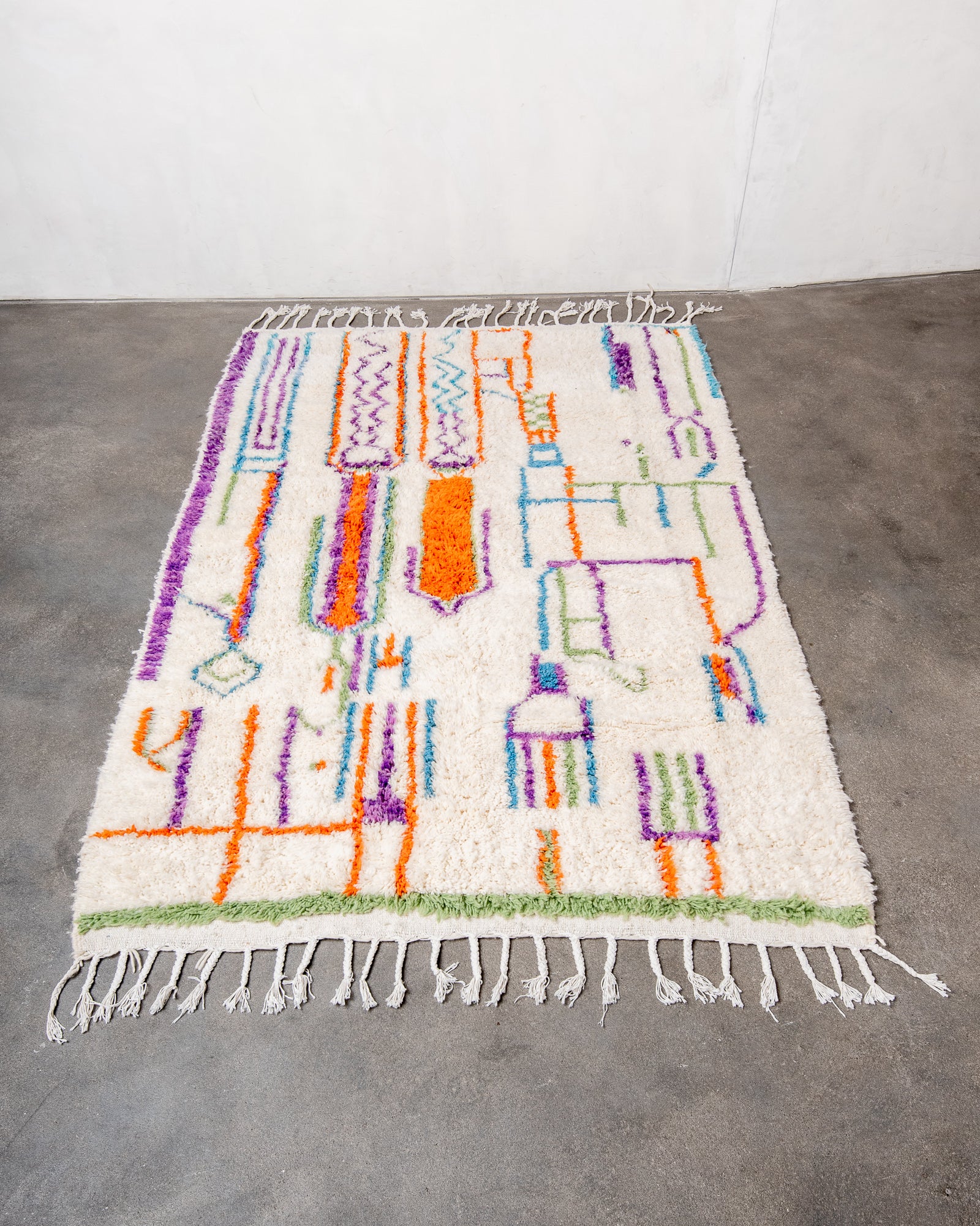 Modern, designer, handcrafted Berber rug from Morocco. Beniourain carpet with beautiful colours and patterns and fluffy wool texture.